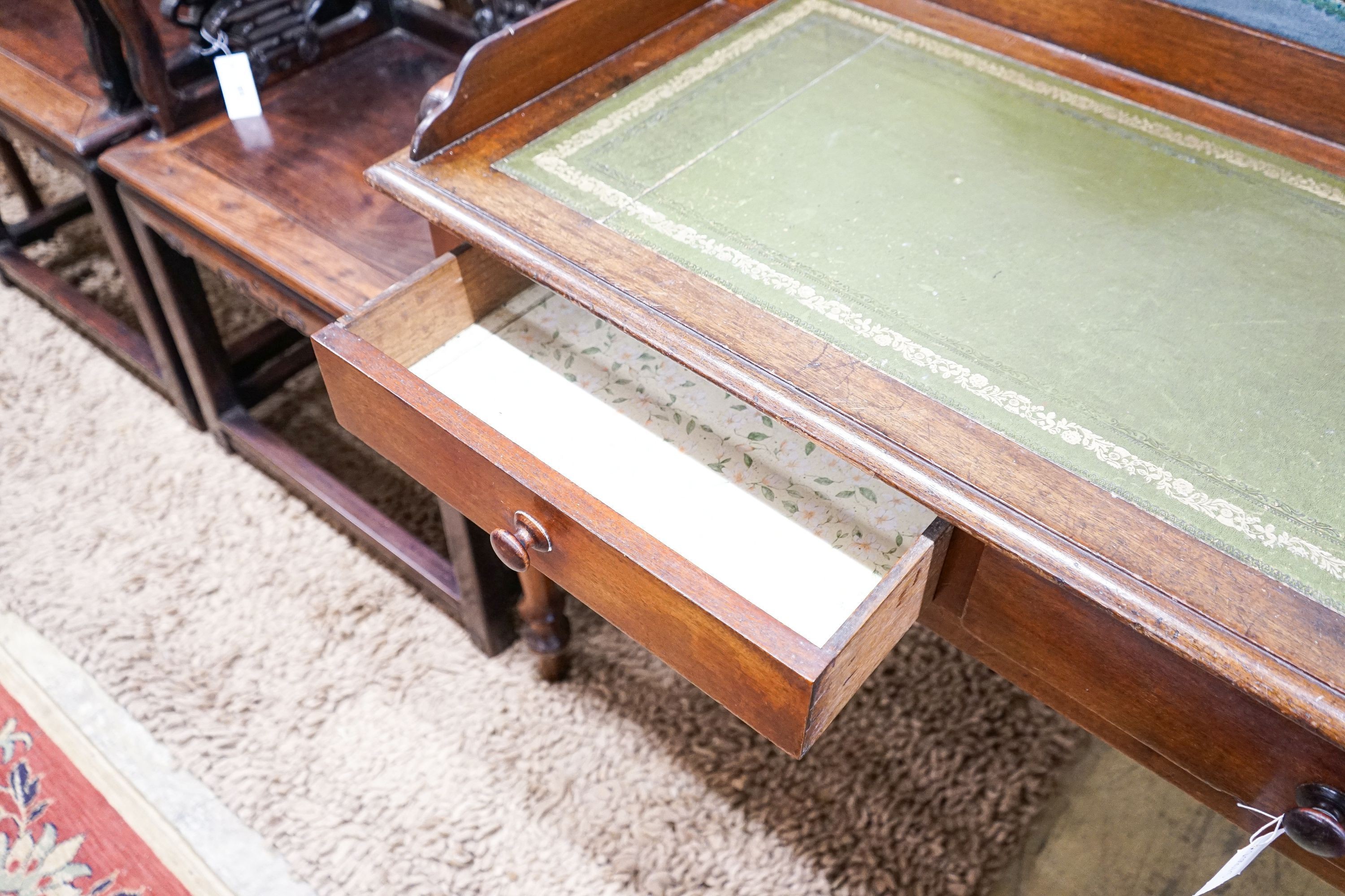 A Victorian mahogany two drawer writing table, length 106cm, depth 53cm, height 82cm